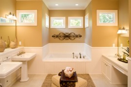 Custom master bathroom with jacuzzi tub and pedastal sinks.